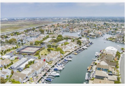 Aerial view of Seagate waterfront homes and private docks in Huntington Harbour