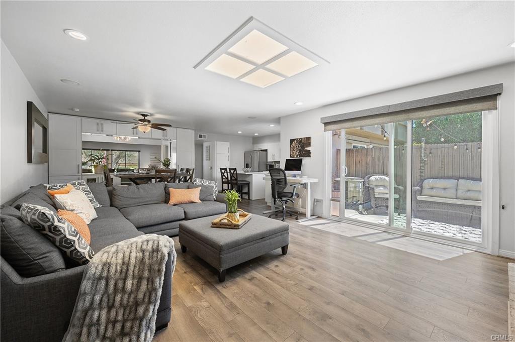 18126 Sand Dunes Ct — open-concept living room with slider to the private patio