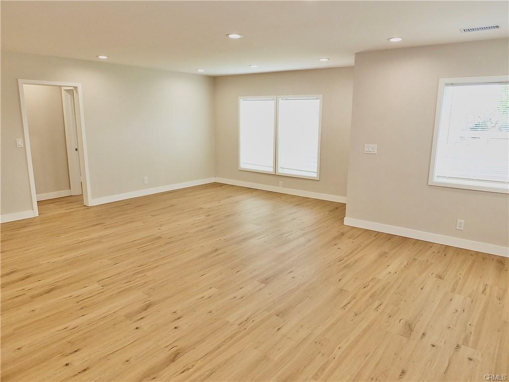 1335 W Burnett St — open-concept living room with new flooring and recessed lighting