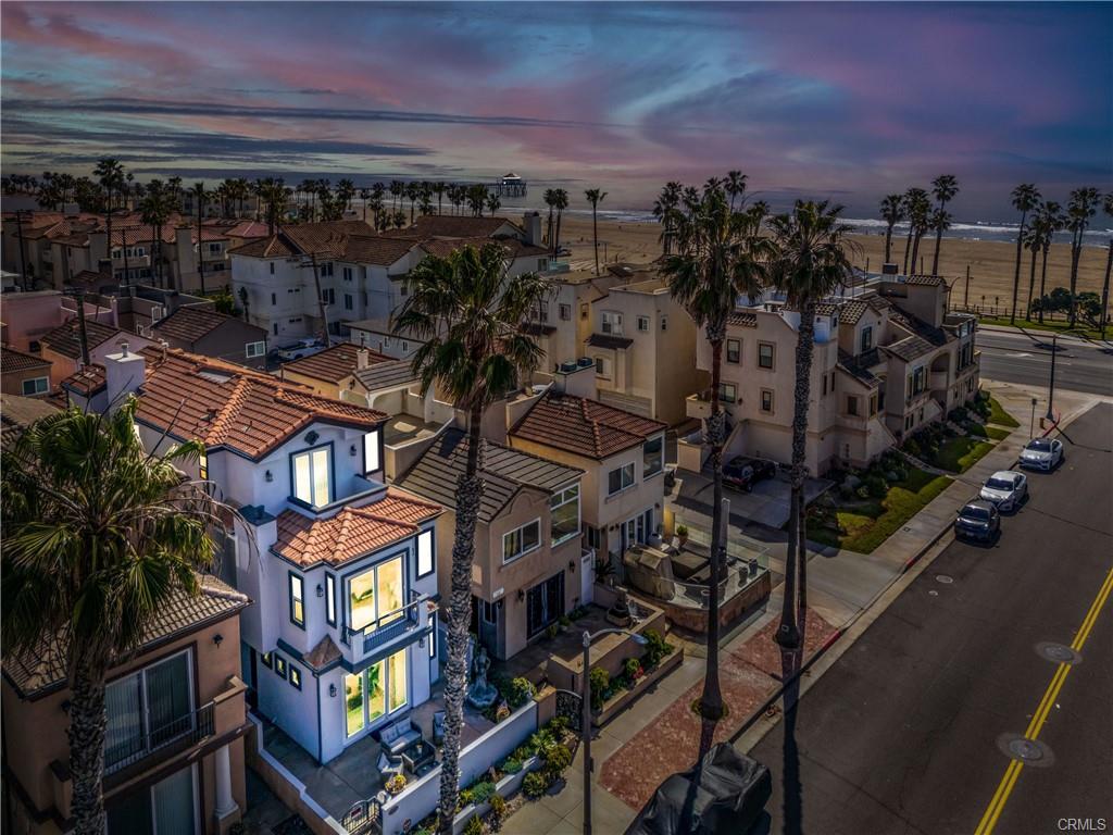 116 11th St — Twilight aerial of the residence with the Pacific Ocean beyond