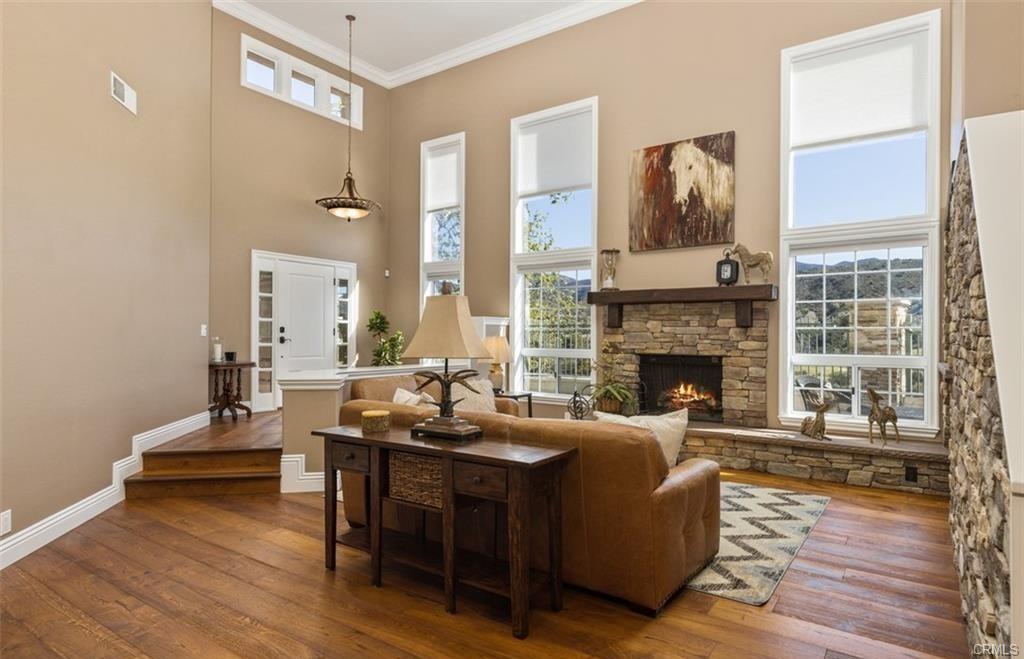 14 Dover — living room with soaring ceilings and stone fireplace