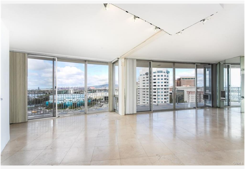 700 E Ocean Blvd #2308 — living area wrapped in glass overlooking the coastline and city