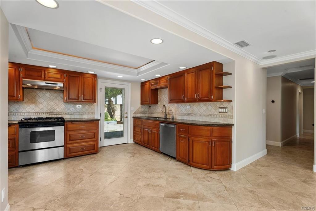2199 National Ave — kitchen with granite counters, stainless appliances, and wood cabinetry