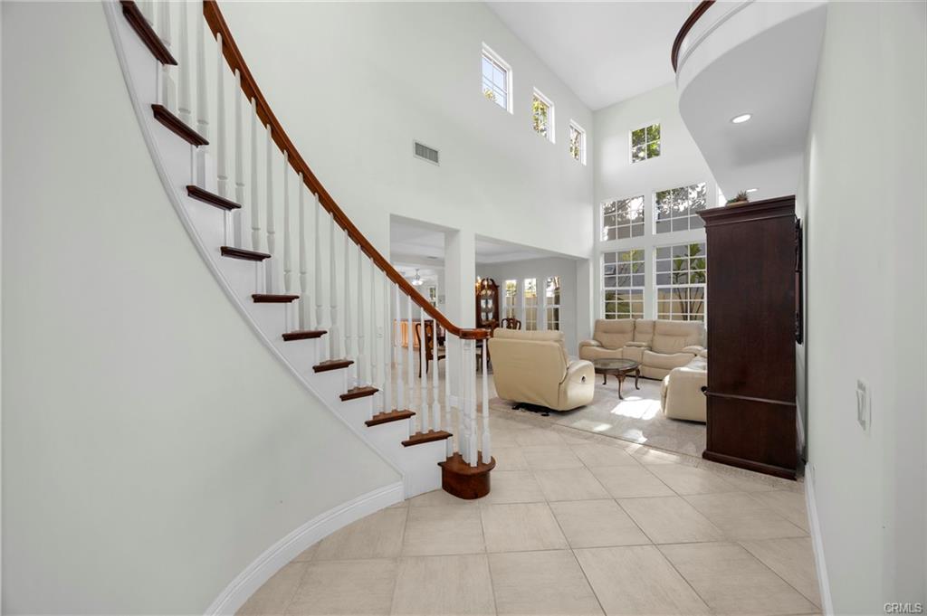 9112 Playa Dr — two-story entry with circular staircase