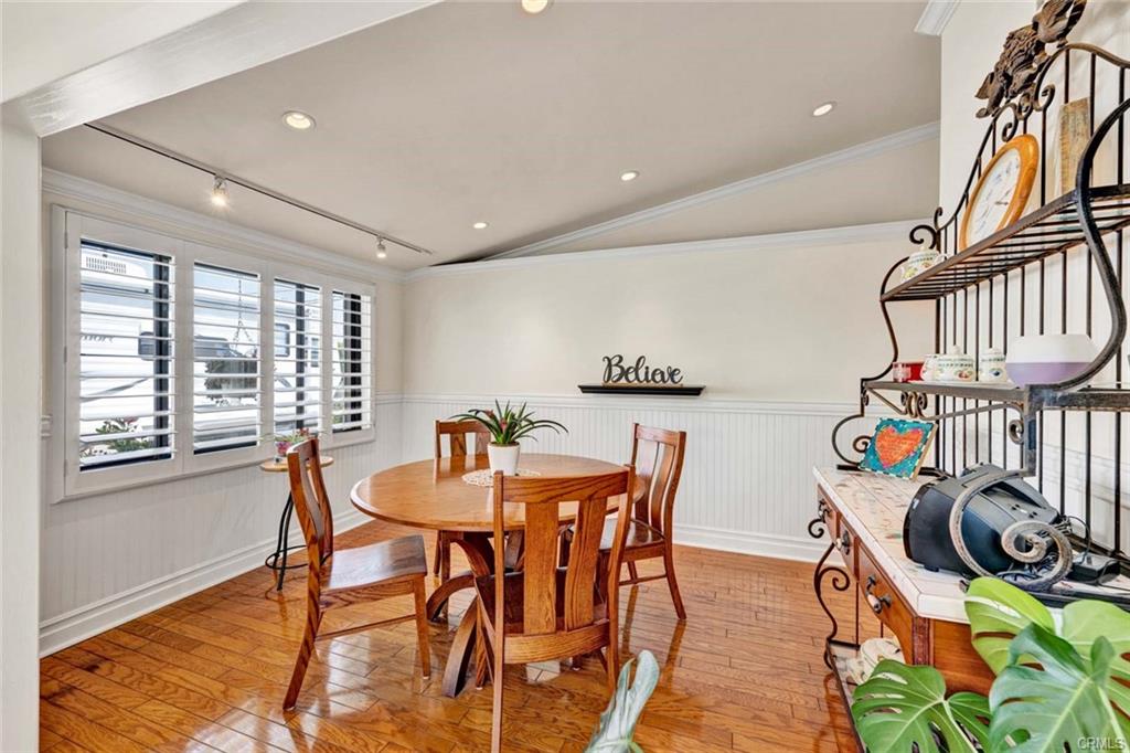 12231 Wilken Way — dining area with plantation shutters and garden views