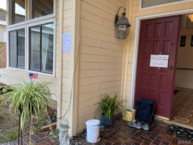 17031 Ward St — covered front porch with double door entry