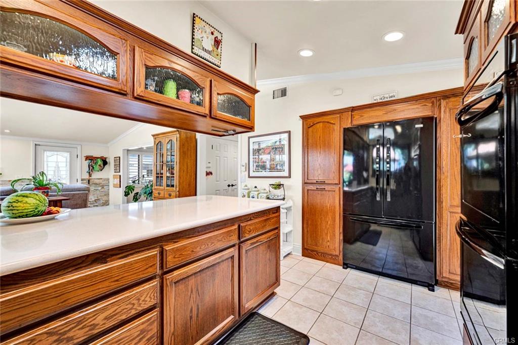 12231 Wilken Way — kitchen with double ovens, gas cooktop, and generous storage