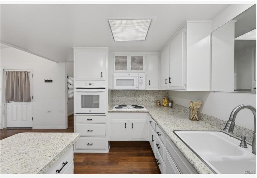 1200 Canoe Brook Dr #19D — kitchen workspace with solar tube lighting and ample storage