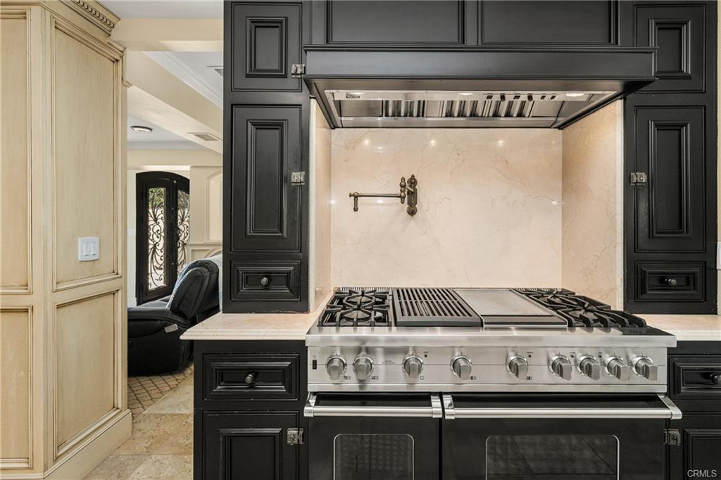 2342 Cynthia Ct — professional Viking range with paneled cabinetry surround