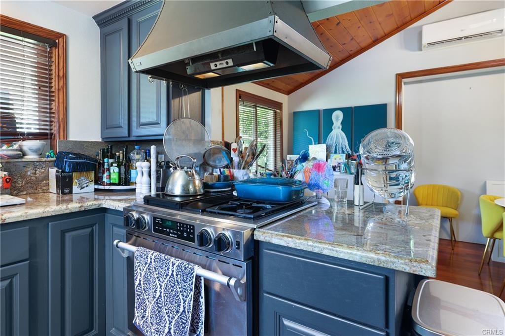 2642 Westminster Pl — kitchen with stone counters and gas range