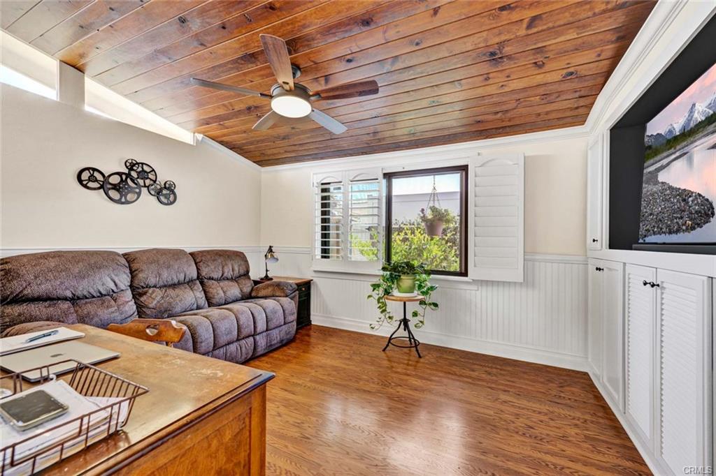 12231 Wilken Way — media room with tongue-and-groove wood ceiling