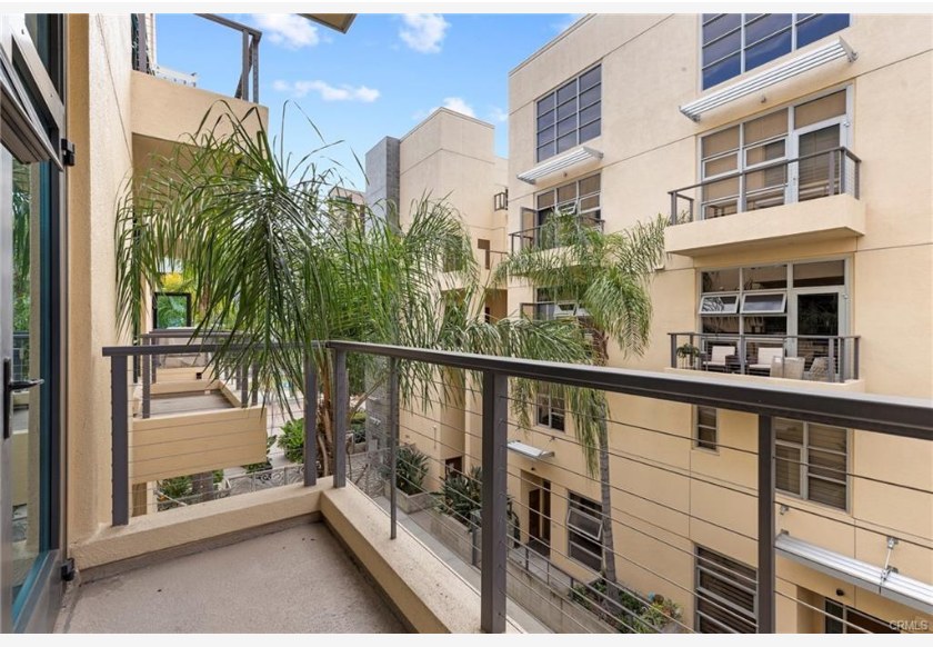 133 The Promenade N #318 — private balcony overlooking the landscaped courtyard