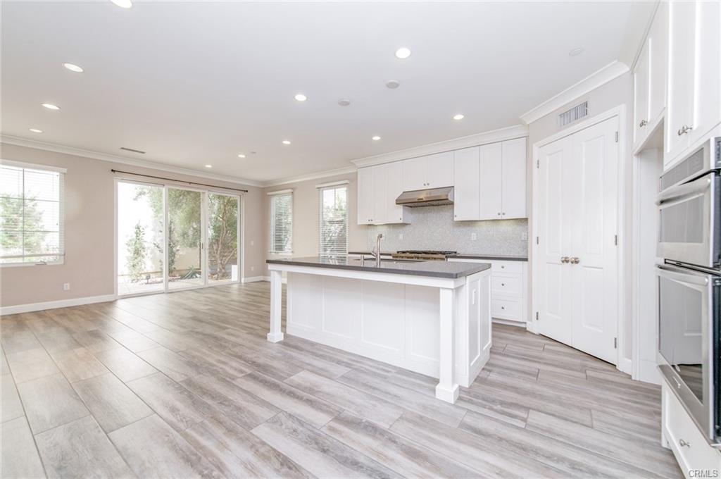 115 Mustang — open kitchen with island overlooking the living and dining rooms