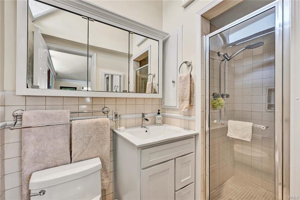 12231 Wilken Way — updated bathroom with walk-in shower and dual mirrors