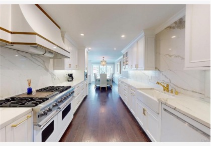 16143 Saint Croix — kitchen with professional range, hood, and extended counter seating