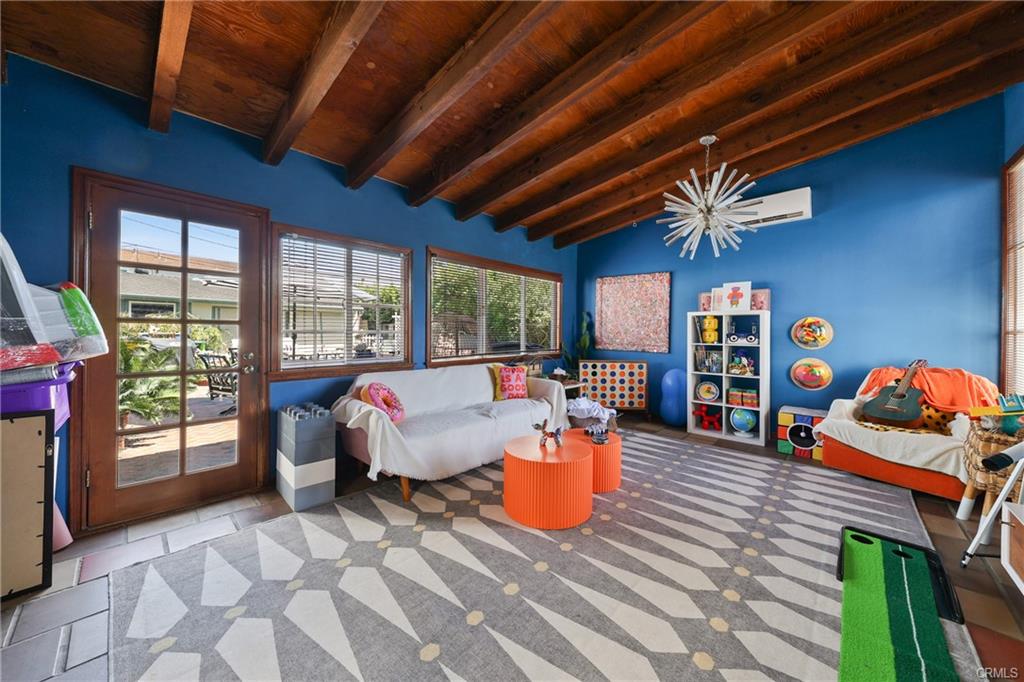 2642 Westminster Pl — sunroom with wood beam ceiling and yard views