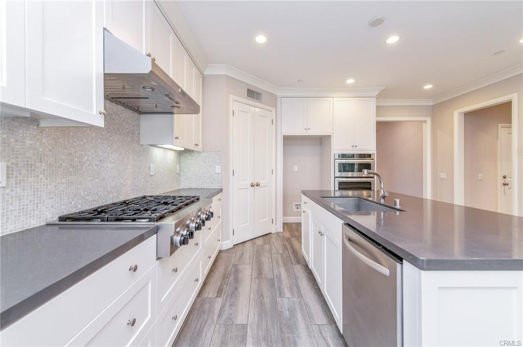 115 Mustang — kitchen with stainless appliances, gas range, and walk-in pantry