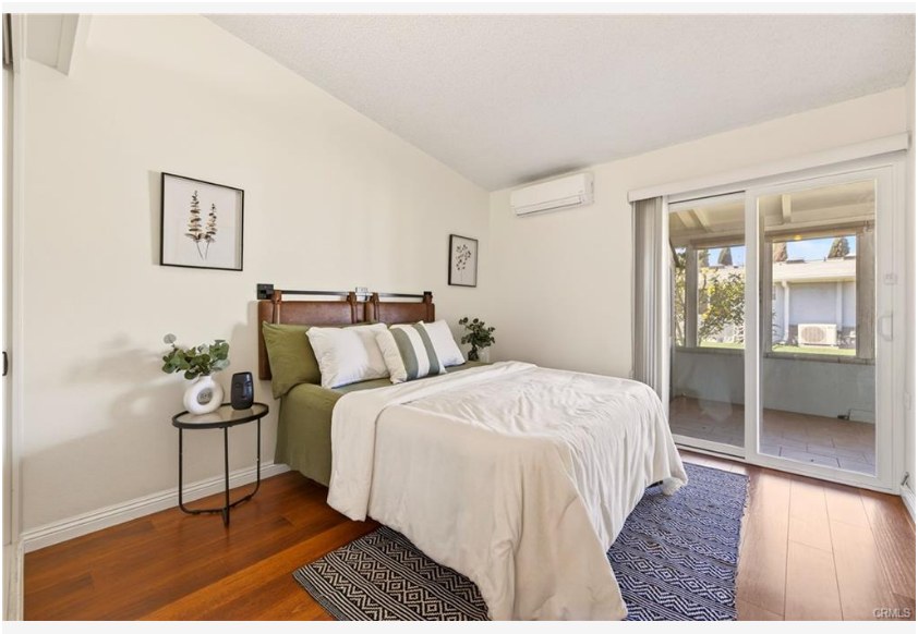 1200 Canoe Brook Dr #19D — second bedroom with sliding door access to the patio