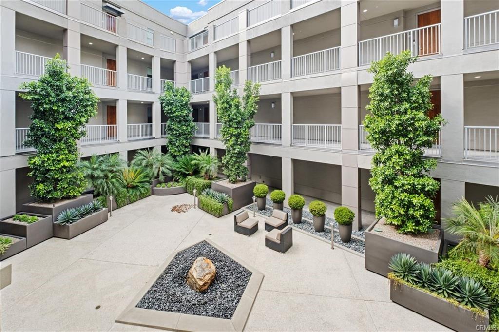 21 Gramercy #202 — landscaped courtyard gardens at The Belvedere