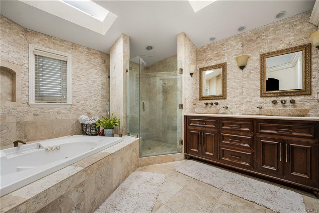 2342 Cynthia Ct — spa-inspired primary bath with soaking tub and skylights