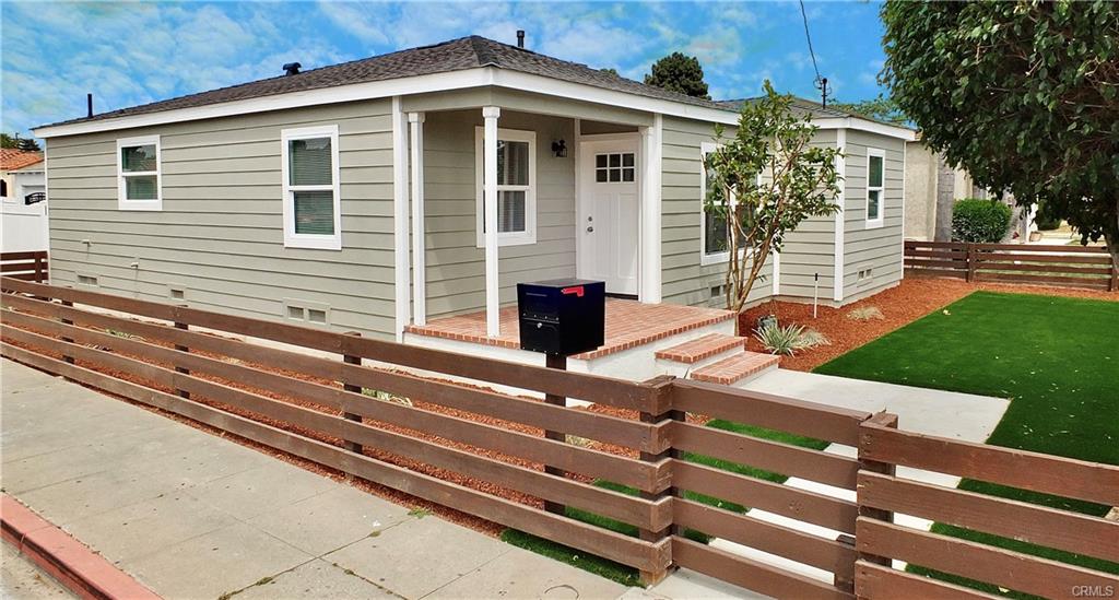 1335 W Burnett St — front exterior with new fencing and landscaped walkway