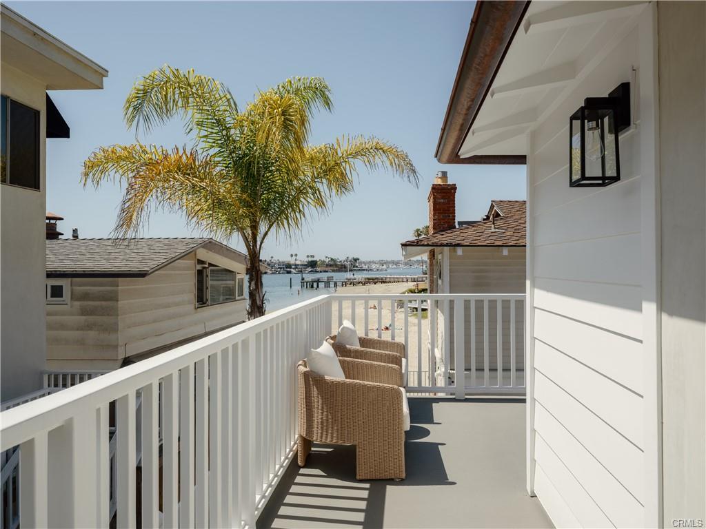 2715 Cove Street — private deck with palm and bay views