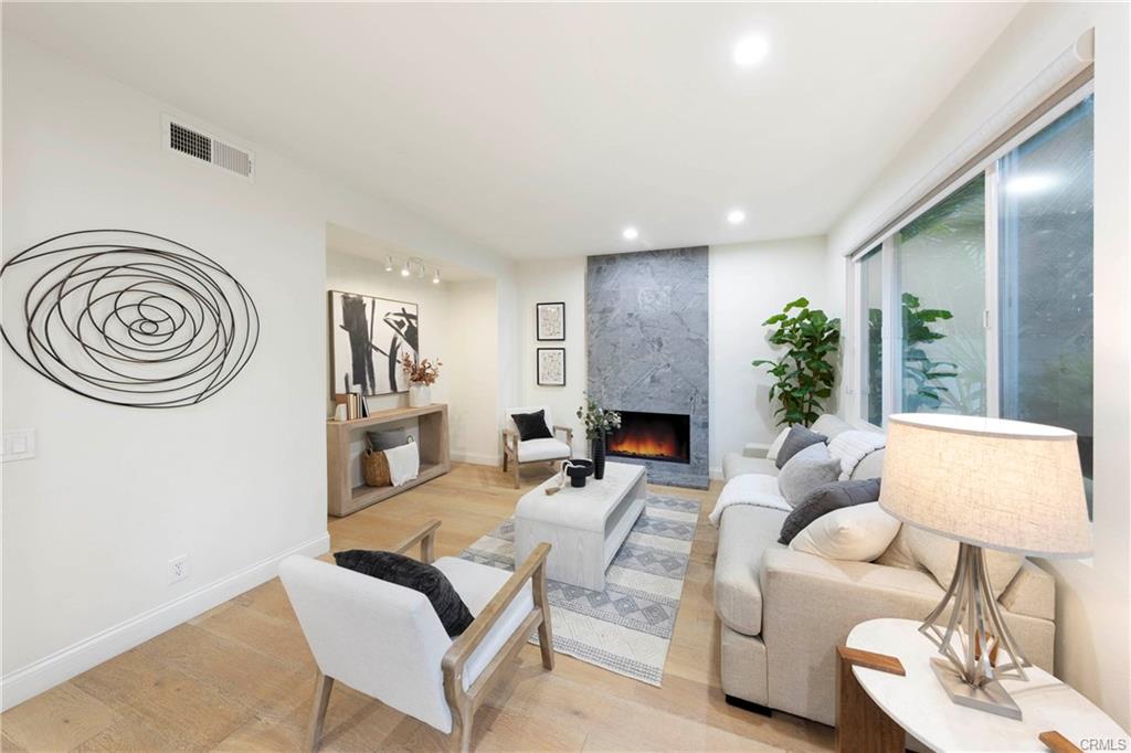 43 Lessay — family room with fireplace and designer furnishings