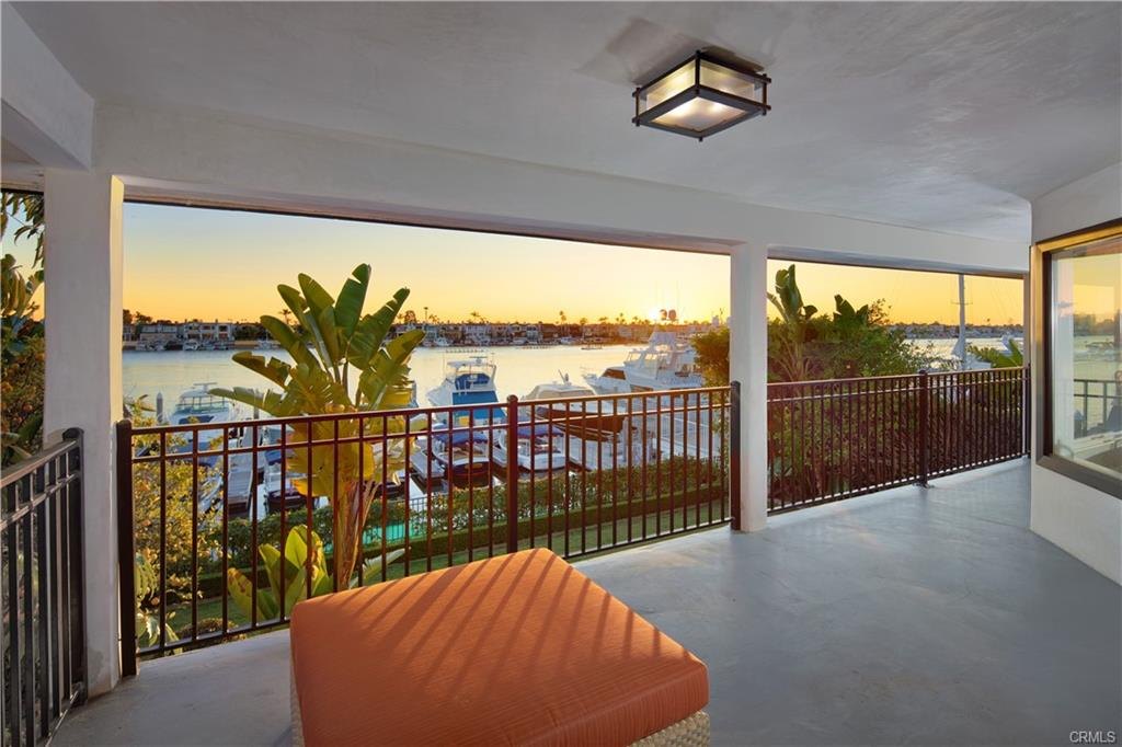 2572 Bayshore Dr — covered patio at sunset over the harbor