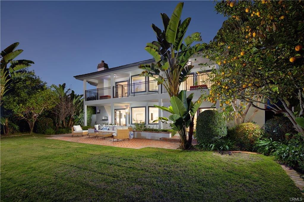 2572 Bayshore Dr — twilight view of the residence from the bay