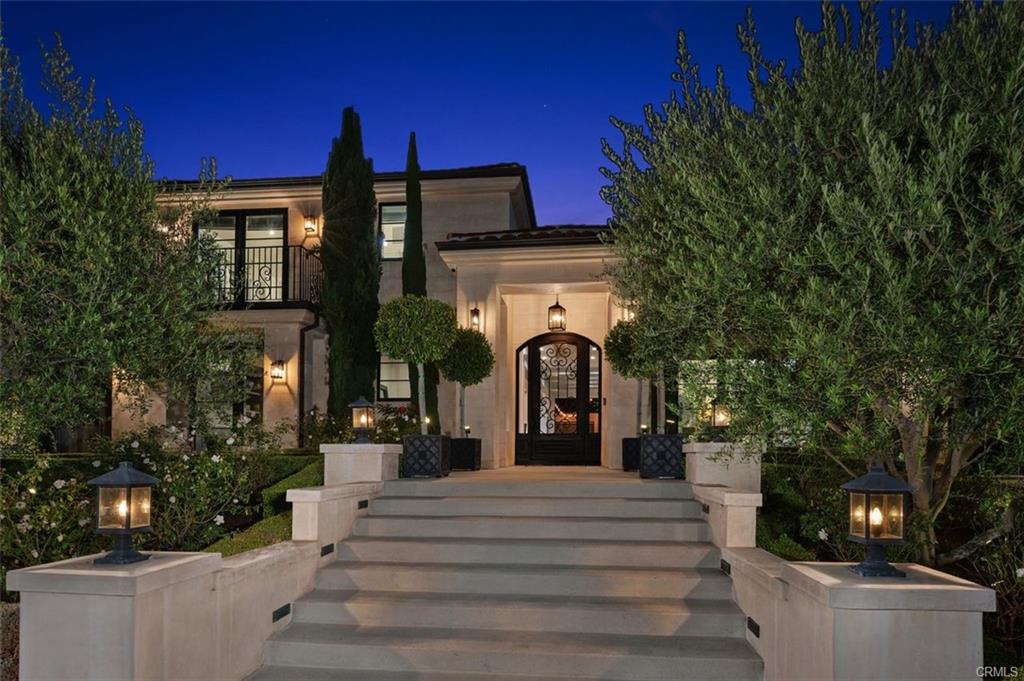 4 Inverness Lane — front elevation of the Big Canyon estate at dusk